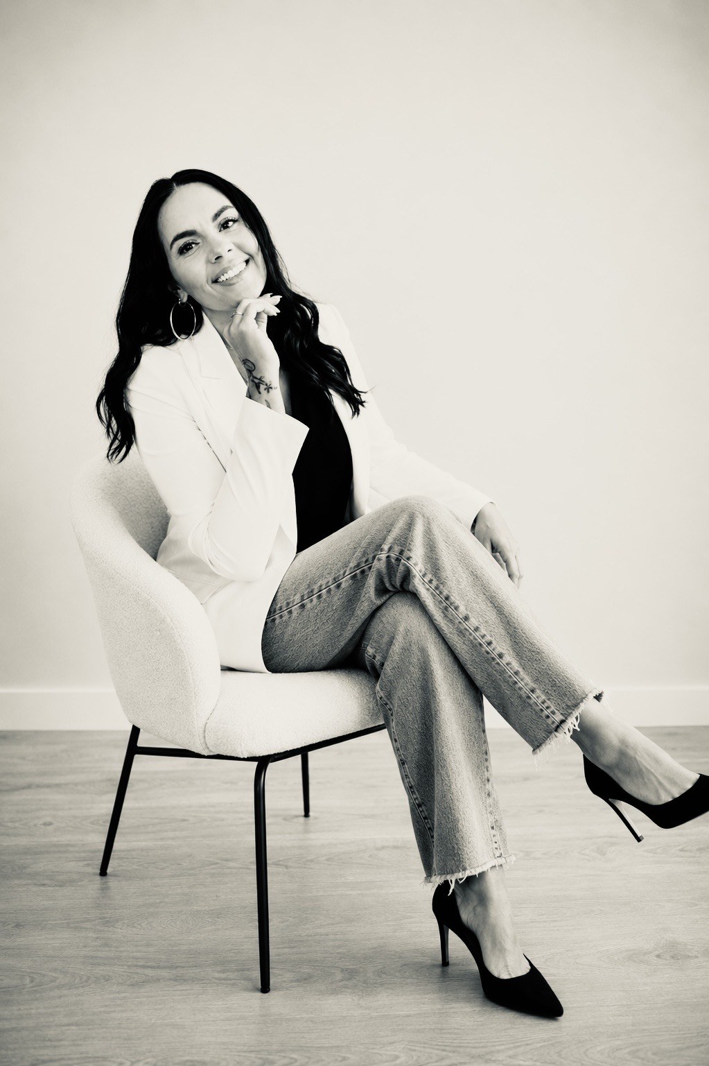 Vanessa Smith, founder of Catwalk Marketing, seated in a quiet studio in a black and white editorial portrait